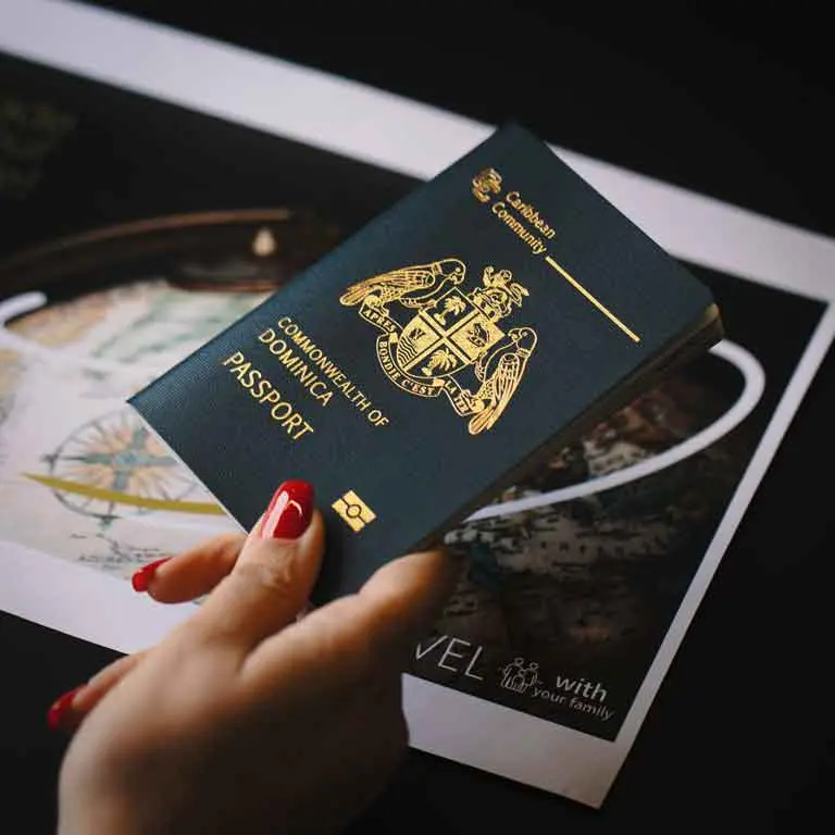 a woman holding a dominica passport - shariftrip; get passport and citizenship of best country